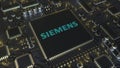 Computer printed circuit board or PCB with Siemens AG logo. Conceptual editorial 3D rendering