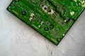 Printed green circuit board, isolated on concrete background Royalty Free Stock Photo