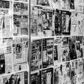 Printed Newspapers Covering A Closed Retail Shop Window During Coronavirus Covid-19 Lockdown