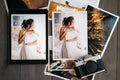 Printed wedding photos with the bride, a vintage black camera and a black tablet with a picture of bride Royalty Free Stock Photo