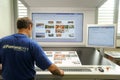 Printer checking a print run at table Royalty Free Stock Photo