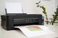 Printer, copier, scanner, workplace. Small printer for use and printing at home Royalty Free Stock Photo