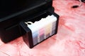 Printer ink tank for refill at office - Close up printer cartridge inkjet of color black CMYK , selective focus