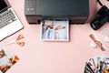 Printer, laptop and camera on table close up. Printing photos Royalty Free Stock Photo