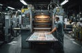 Printer Operator Working on Press in Printing Factory Environment Royalty Free Stock Photo