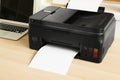 Printer with paper on table, closeup Royalty Free Stock Photo