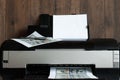 Printer and printed US dollars, counterfeit banknotes, currency counterfeiting. Counterfeiters, printing press, inflation