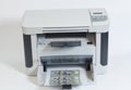 Printer printing fake dollar bills on white