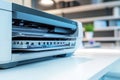 A printer sitting on a white desk, ready for use Royalty Free Stock Photo