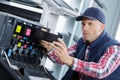 Printer technician removing cartridge container