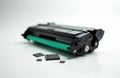 Printer toner cartridge and reset chips lie on white surface. Component needs replace for laser printer or copier. Repair and Royalty Free Stock Photo