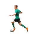 Football player in green jersey running with ball, side view, isolated low polygonal vector illustration. Soccer Royalty Free Stock Photo