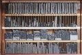 Printing press letter blocks in a wooden shelf