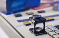 Printing process with magnifying glass, and densitometer Royalty Free Stock Photo