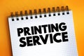 Printing Service text on notepad, concept background