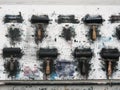 Printmaking rollers hanging on an art studio wall in the messy workshop Royalty Free Stock Photo