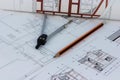 Printouts of house plan drawings on the table Royalty Free Stock Photo