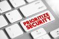 Prioritize Security text button on keyboard, concept background Royalty Free Stock Photo