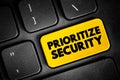 Prioritize Security text button on keyboard, concept background Royalty Free Stock Photo