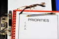 Priority plan in a folder-a concept that shows the importance, primacy, determines the order of preference of execution in time in Royalty Free Stock Photo