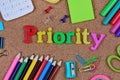 Priority word on cork Royalty Free Stock Photo