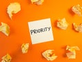 Priority word handwritten on sticky note. Management skills, important and urgent tasks, strategy, planning, business concept Royalty Free Stock Photo