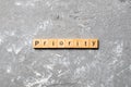 Priority word written on wood block. priority text on table, concept Royalty Free Stock Photo