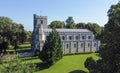 Priory church of St Peter in Dunstable among the trees on asunny day Royalty Free Stock Photo