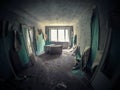 Pripyat, Chernobyl zone: abandoned flat with wallpapers hanging down. Royalty Free Stock Photo