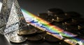 Prism Refracting Light onto Coins Closeup Royalty Free Stock Photo
