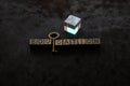 Prism beside retro styled metallic decorative key and education wording