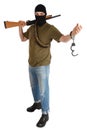 Prison break - robber in black mask with shotgun removing handcuffs isolated on white background Royalty Free Stock Photo