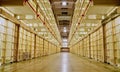 Prison cell block with cells on both sides. Royalty Free Stock Photo