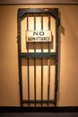 Prison cell door on a wall with the words "No Admittance" Royalty Free Stock Photo