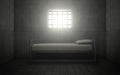 Prison cell with light shining through a barred window. Royalty Free Stock Photo