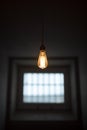 Prison cell with old lamp and small window Royalty Free Stock Photo