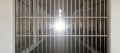 Prison corridor, jail cell and closed steel bar door, empty dark facility interior, 3d render Royalty Free Stock Photo