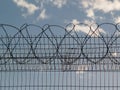 Prison fence with barbed wire