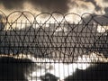 Prison fence with barbed wire