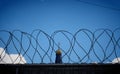 Prison fence with barbed wire