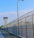 Prison fence in morning sun