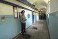 Prison hallway of a prison and guard standing Royalty Free Stock Photo