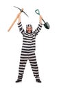 Prison inmate with axe and spade Royalty Free Stock Photo