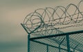 Prison security fence. Barbed wire security fence. Razor wire jail fence. Barrier border. Boundary security wall. Prison for Royalty Free Stock Photo