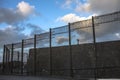 Prison walls and security fence. Peterhead, Scotland Royalty Free Stock Photo