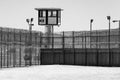 Prison Yard Empty with guard tower in black and white Royalty Free Stock Photo