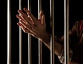 Prisoner behind bars Royalty Free Stock Photo