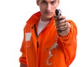 Prisoner with gun isolated on white background Royalty Free Stock Photo