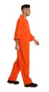 Prisoner in orange jumpsuit on white background