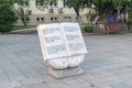 Book sculpture with inscription about effect of reading books